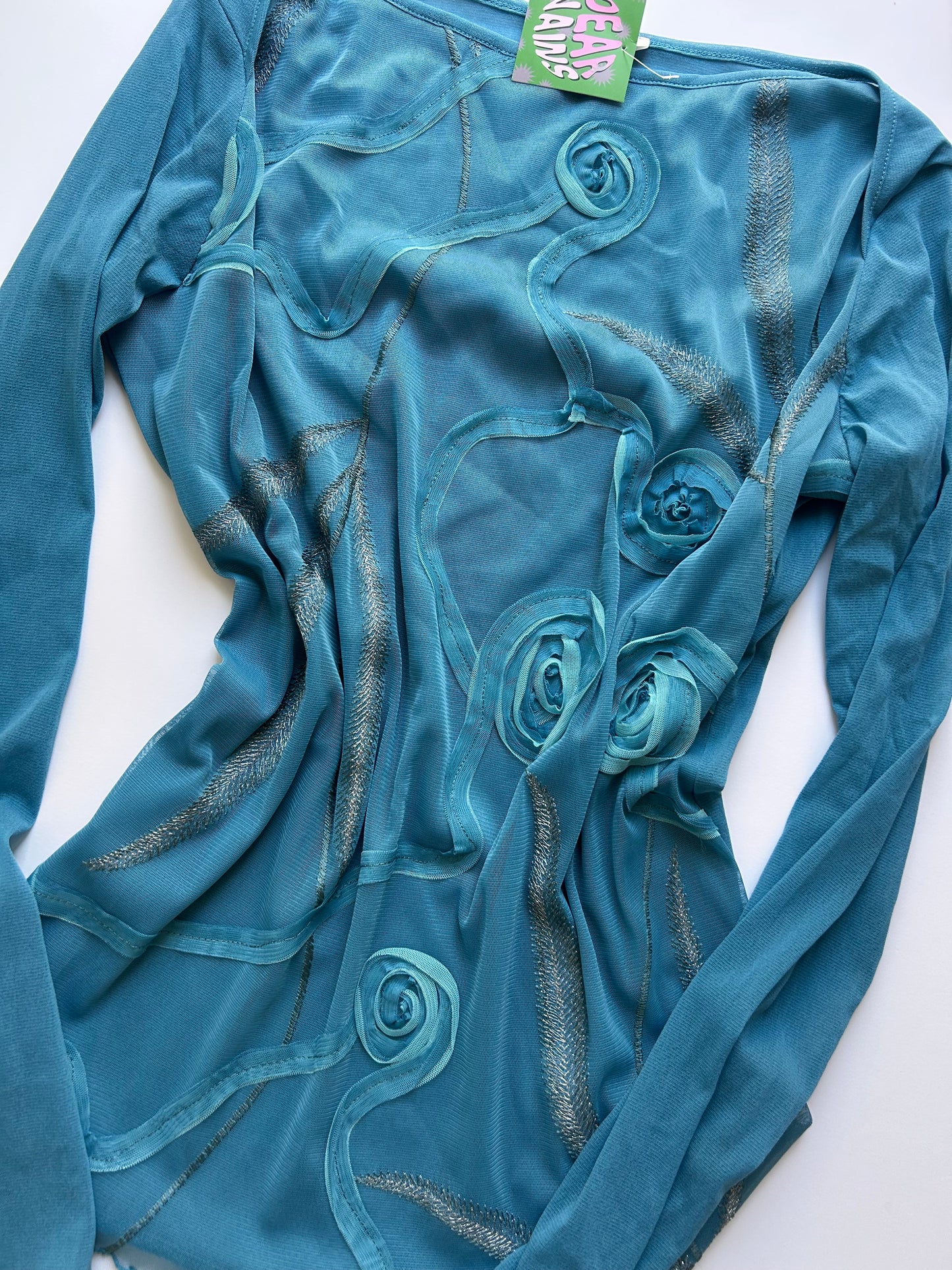 Iconic long sleeve blue top with rose detail size M/L