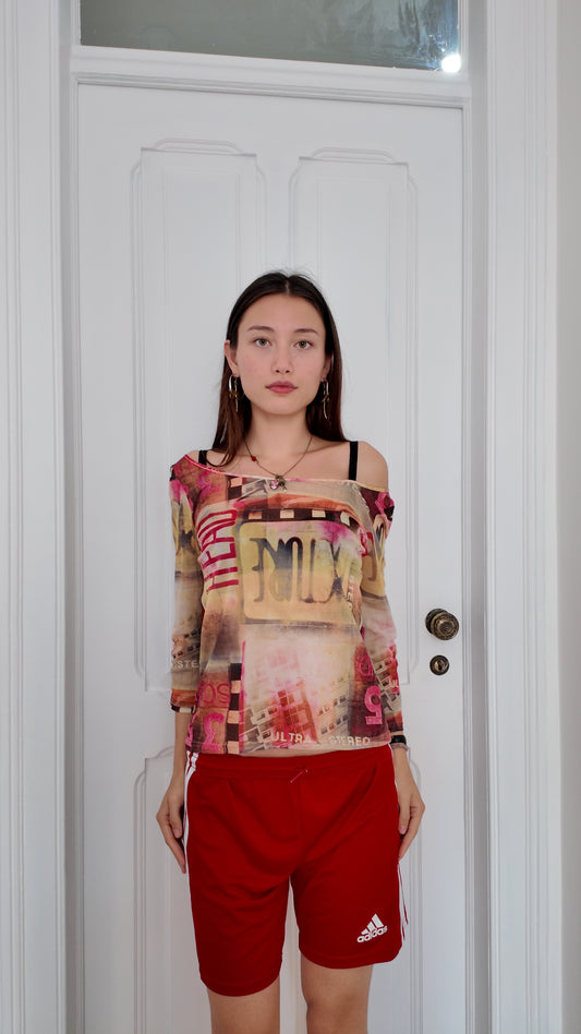 Adorable sheer graphic top size M/L